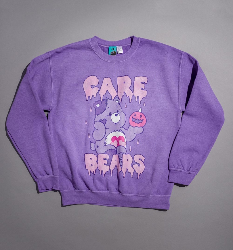 An image of Care Bears Spooky Pumpkin Vintage Wash Lavender Sweater
