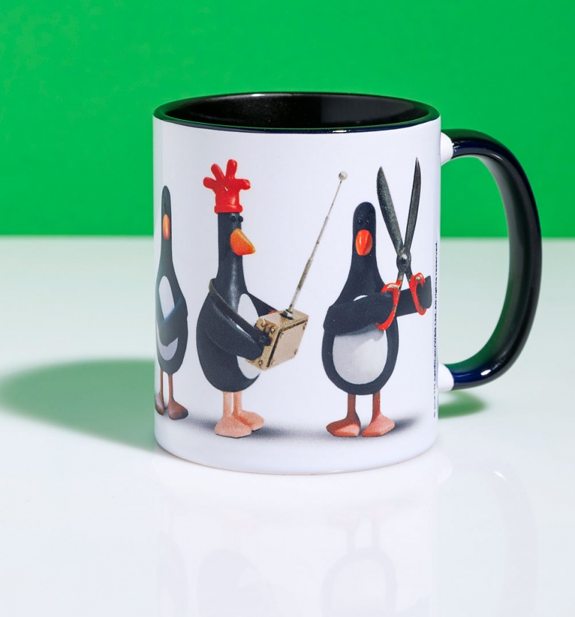 An image of Feathers McGraw Line Up Mug With Black Handle