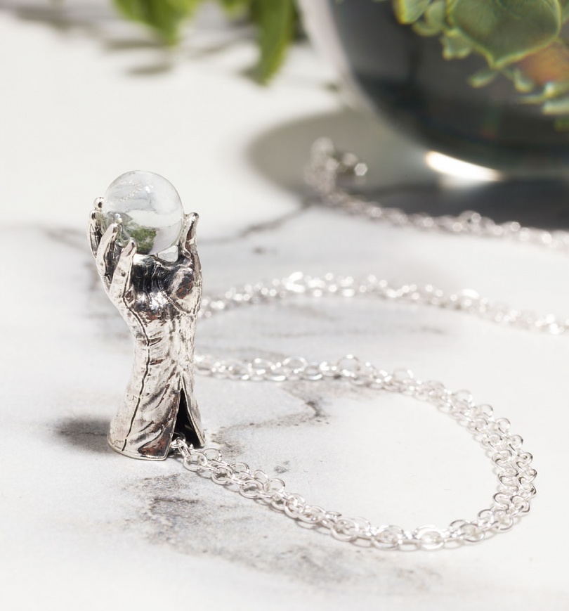 An image of Sterling Silver Labyrinth Jareth Glove and Crystal Ball Necklace
